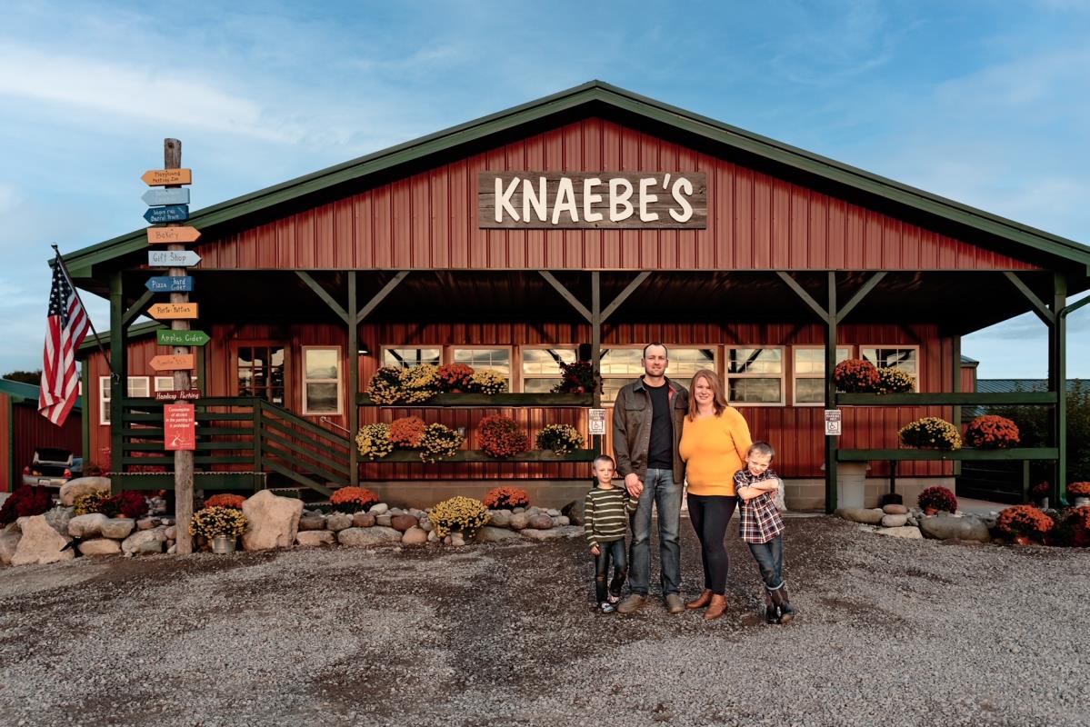 Knaebe's Apple Farm and Ciderworks and family in front