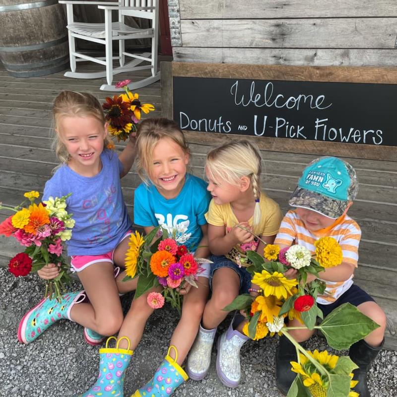 Girls with flowers at Kreps Apple Barn and Cider Mill in Lasalle, Michigan