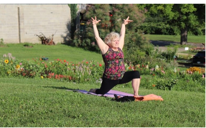 Woman doing yoga at Corey Lake Orchards