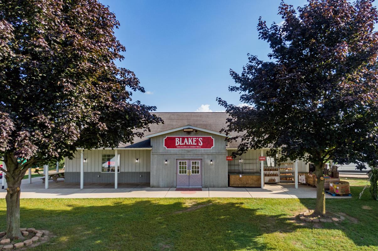 Blake's South Lyon Farm Market and Cider Mill with blue sky and trees