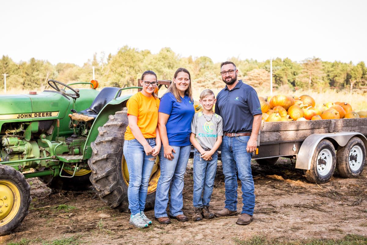 Stephenson Farm Market in Three Rivers standing by tractor