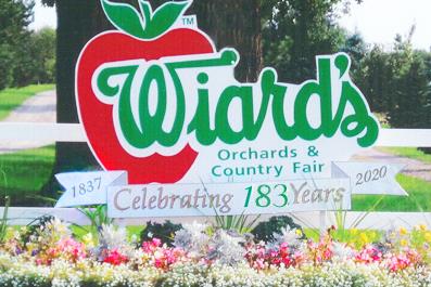 Wiards' Orchard Farm logo and flowers